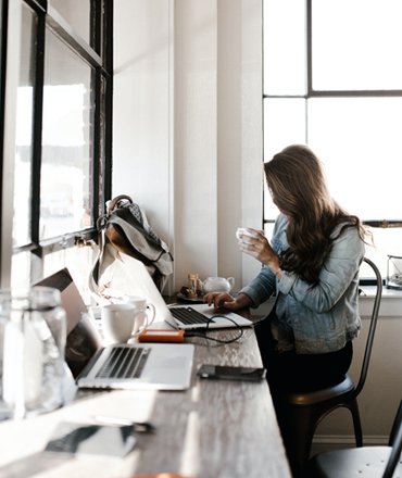 a person at a desk with a computer