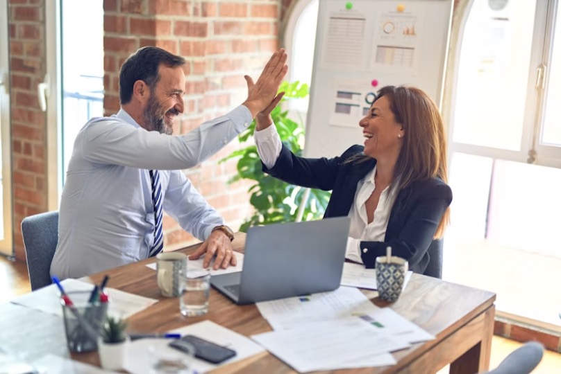 two people high fiving