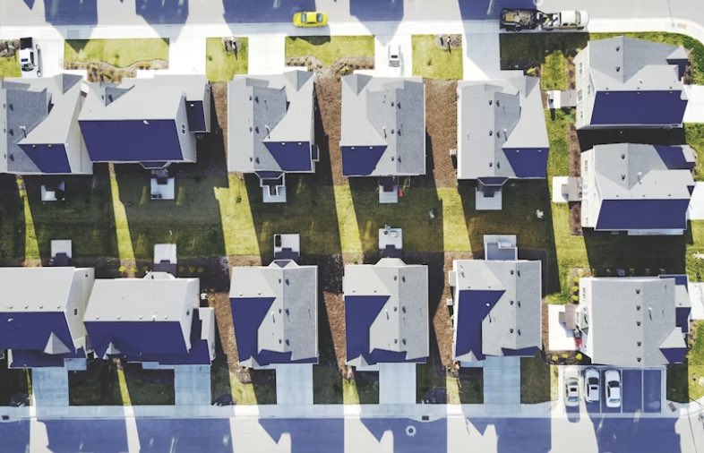 an aerial view of a neighborhood showing a bunch of houses