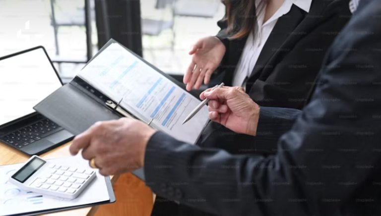 a hand with a pen pointing to a schedule on a to do list