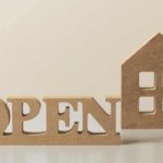 the word open right next to a house