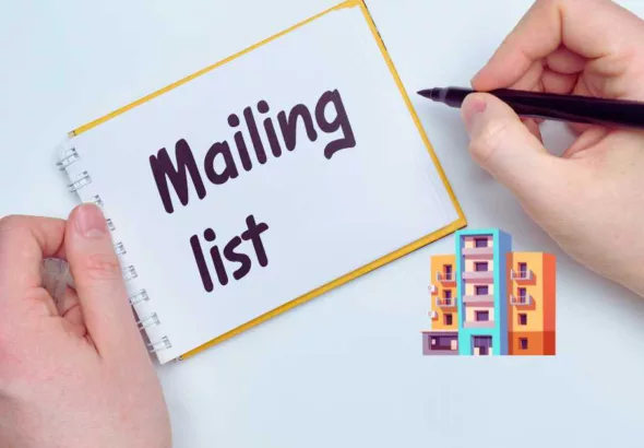 a person writing mailing list on a paper