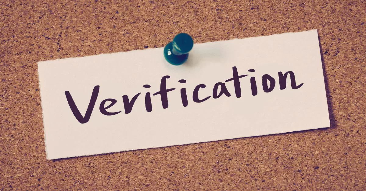 a sign that says verification on a bulletin board