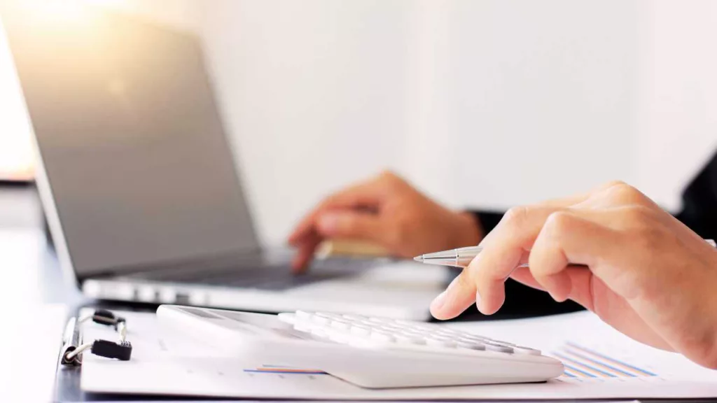 a person using a calculator to do accounting