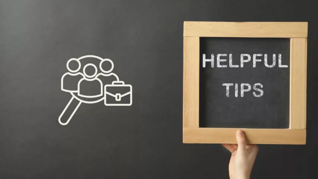 a hand holding up a sign that says helpful tips